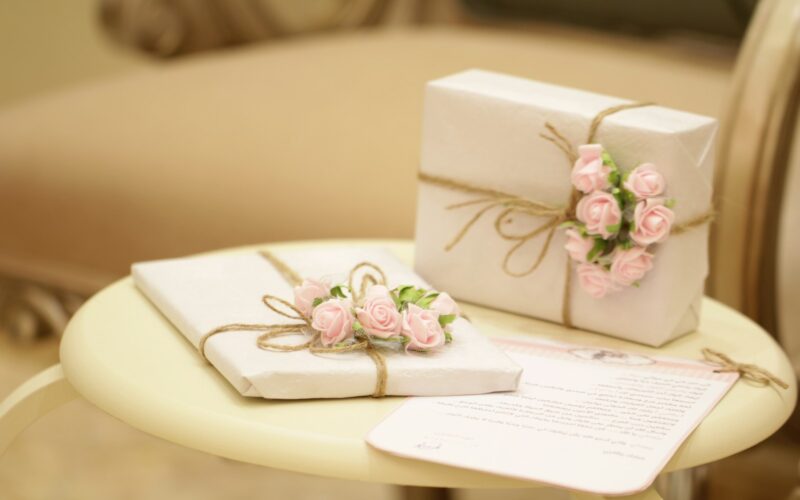 two pink and white floral boxes